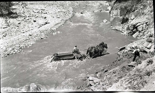 Narrows Trail construction- view of a man on a horse drawn wagon crossing the Virgin River.