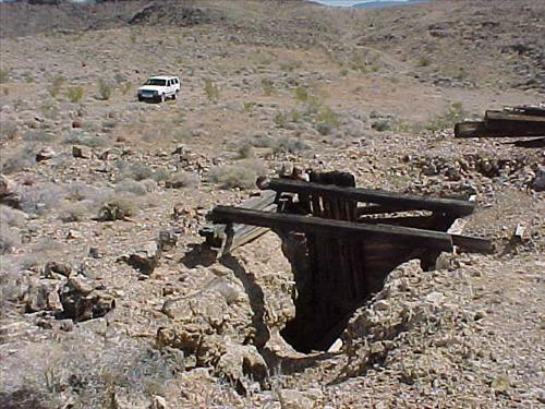 Open shafts and adits at Paymaster Mine, an abandoned gold mine in July 2004.