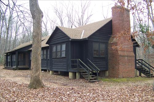 Paint and stain exterior of historic structures in camp 3 and camp 5 at Prince William Forest Park April 2012.