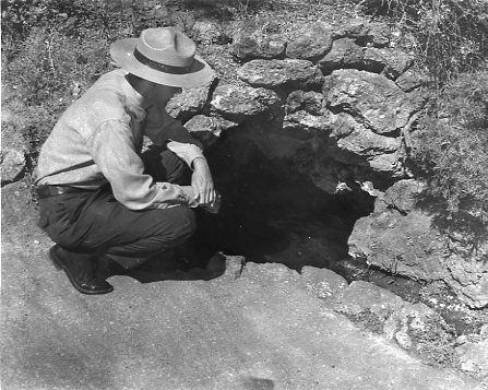 Black & white negative (safety, acetate), 2 color negatives, photo record card; Lower Display Spring & park Ranger Bill Keith crouching behind Maurice B.H.