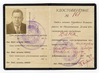 Two pages facing of visa in Cyrillic text with photo of Harry Dana pasted in upper left and 