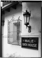 B&W photo of lantern and wrought Iron grate over window