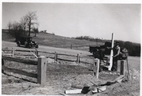 Fashioning hand hewn fence around graveyard