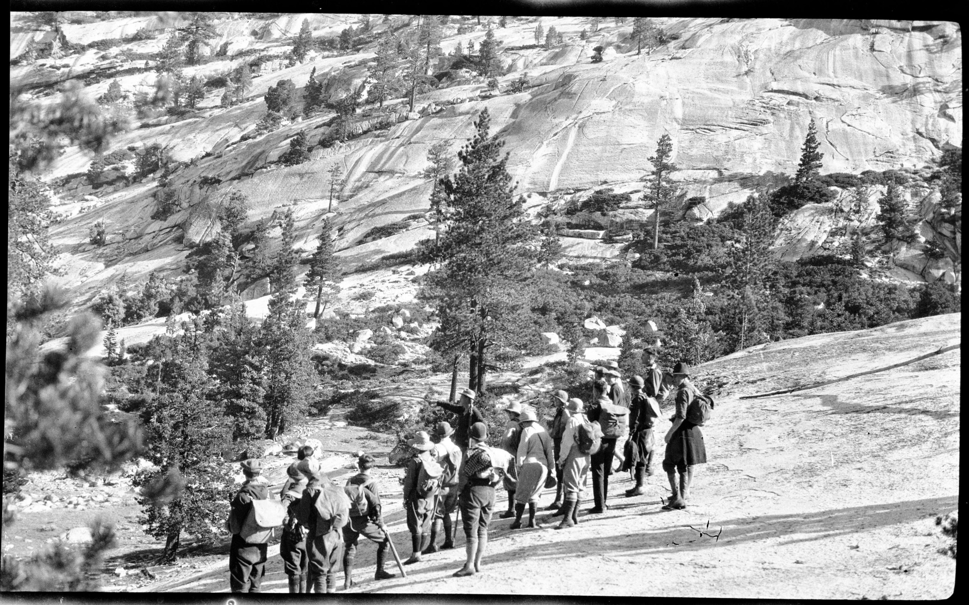 Yosemite School of Field Naural History, class of 1926 with Dr. Bryant at Merced Lake. The following was written on the back of the photo by C.A. Harwell: 'I want you to learn to read a trailside as a book.' Merced Lakd Camp -- just starting for Booth Lake, 8/2/26.