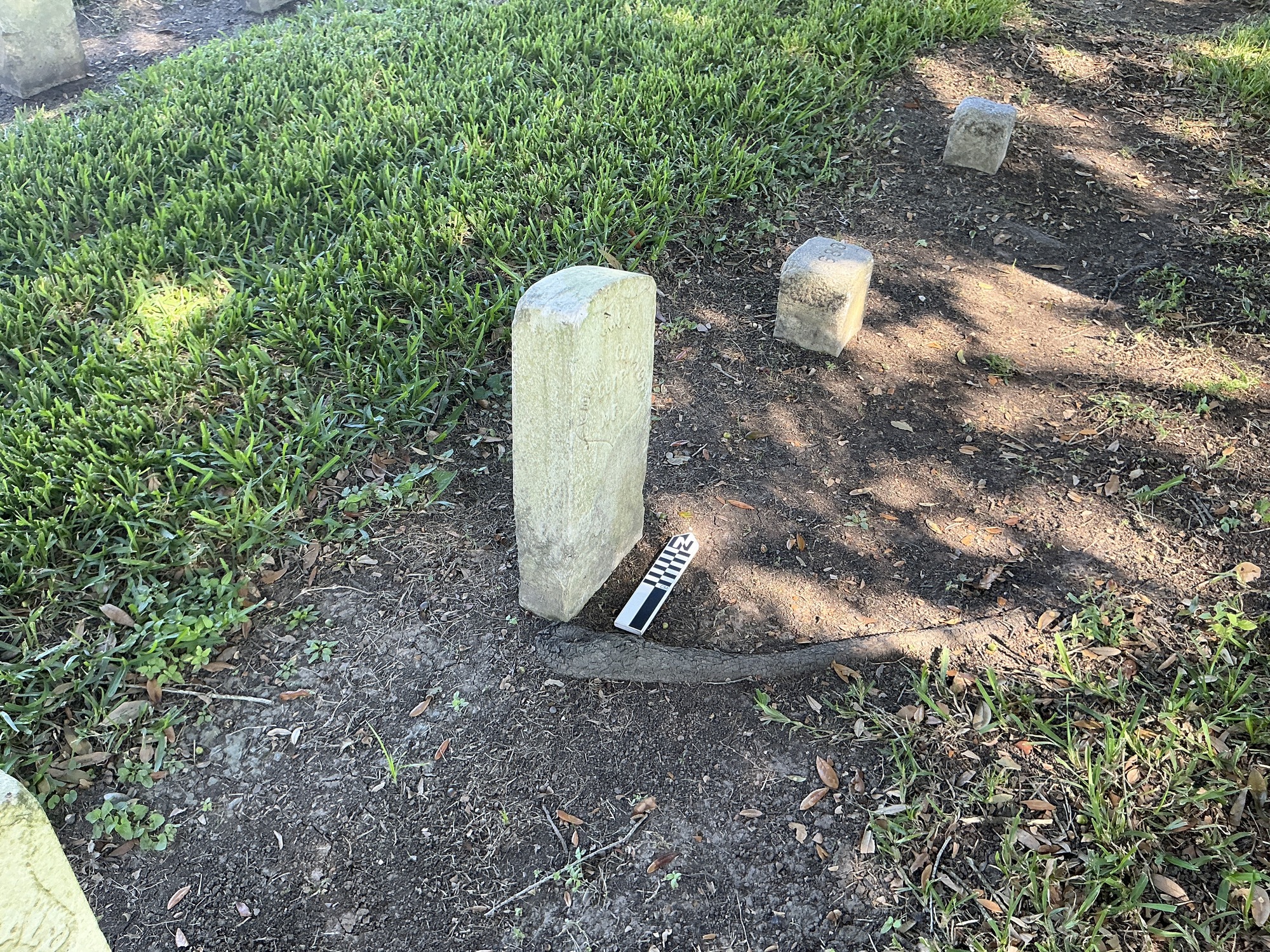 Extra image of historic upright marble headstone with recessed shield face.