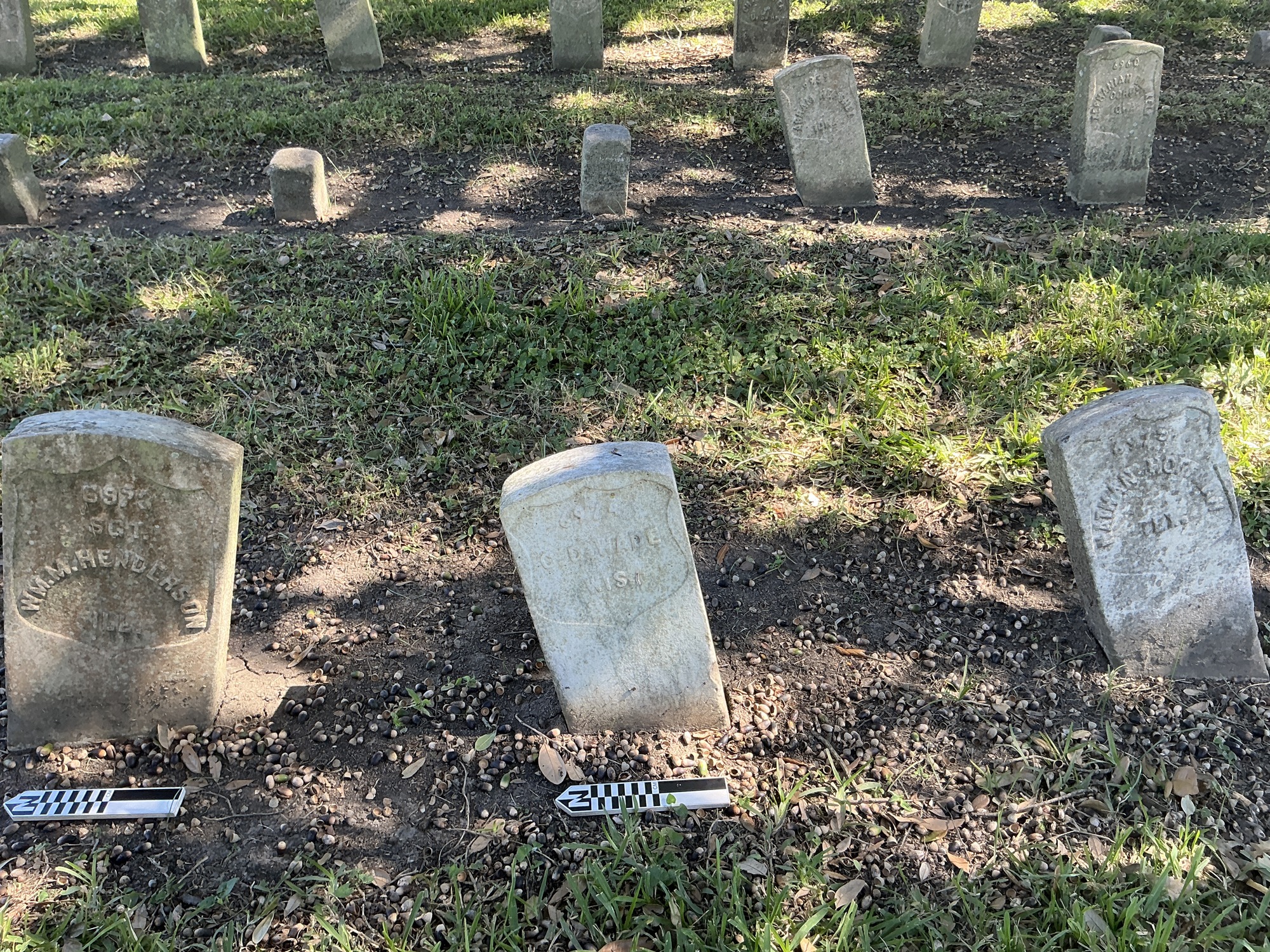 Extra image of historic upright marble headstone with recessed shield face.