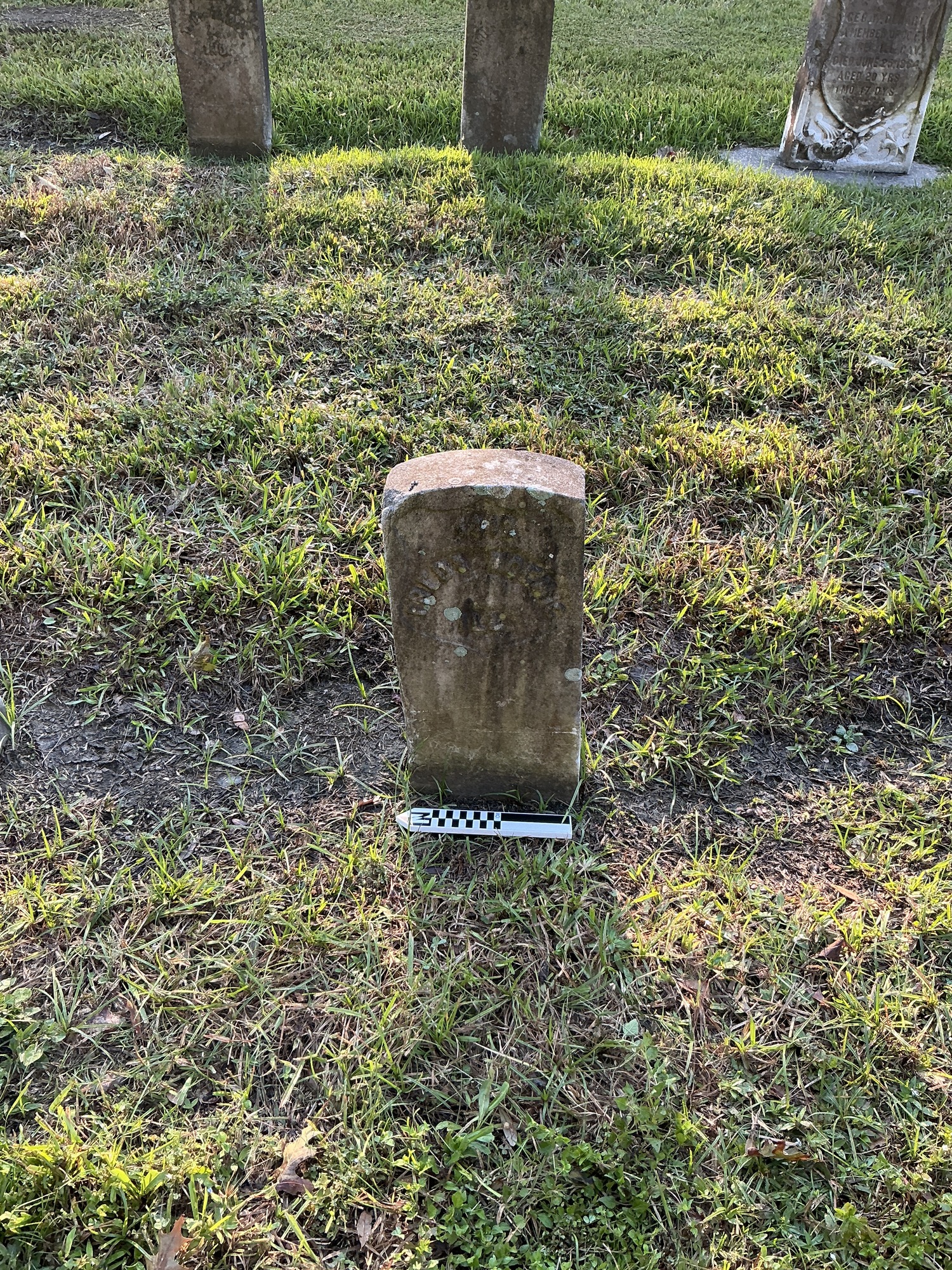 Extra image of historic upright marble headstone with recessed shield face.