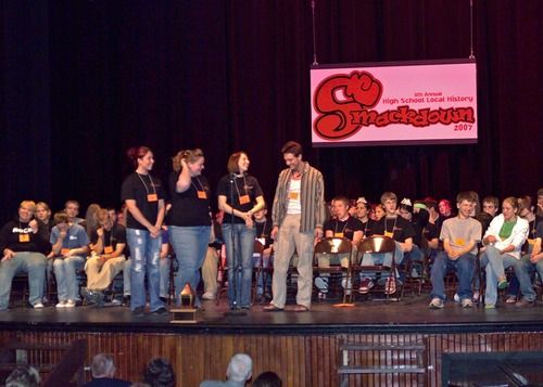 The Ontonagon Rum Runners deliberate over a question during Round 2 of the 5th Annual Smackdown.
