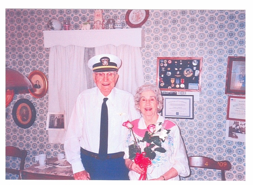 uniformed older man and woman