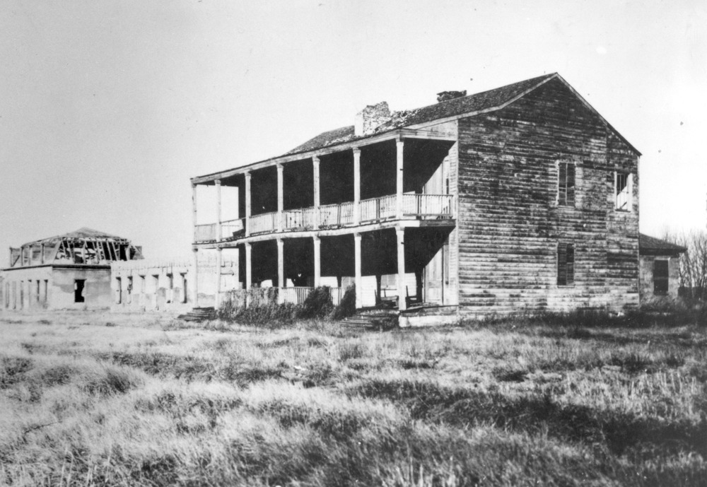 Photograph of Old Bedlam - a two-story building used as the bachelor officer's quarters.