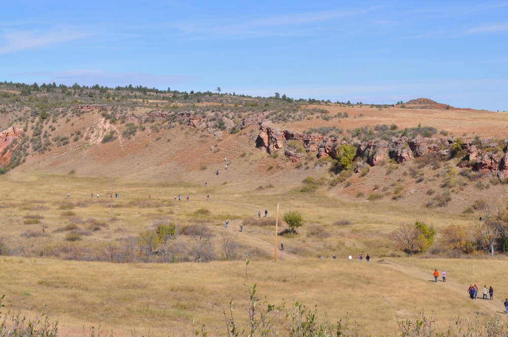 Visitors exploring the Sanson Buffalo Jump on Dedication Day