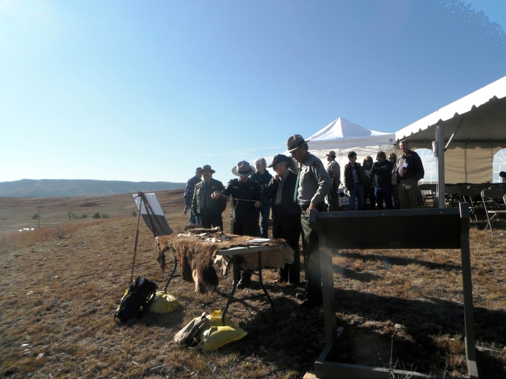 Buffalo Jump and touch table with bison hide, horns, etc at Casey Land Dedication
