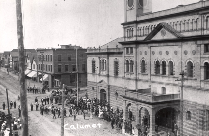 A crowd gathers near the Calumet Theatre