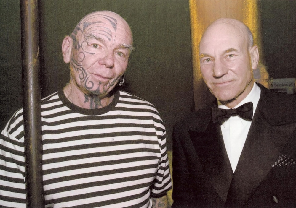 A park volunteer standing next to Patrick Stewart.