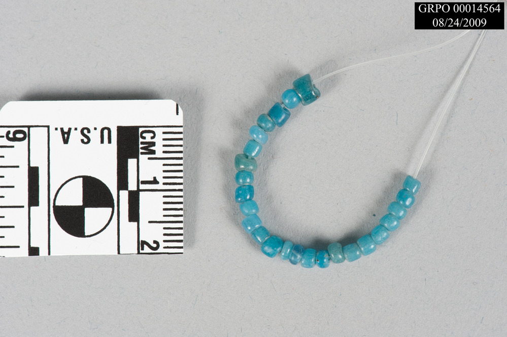 A string of turquoise-colored glass beads.