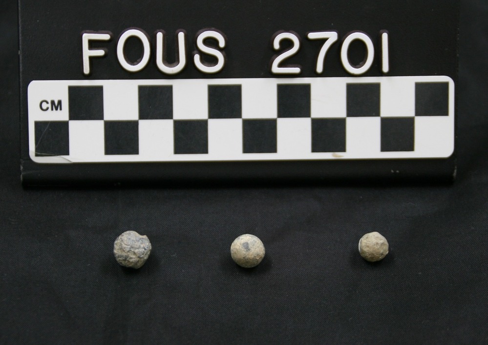 Three lead musket balls.