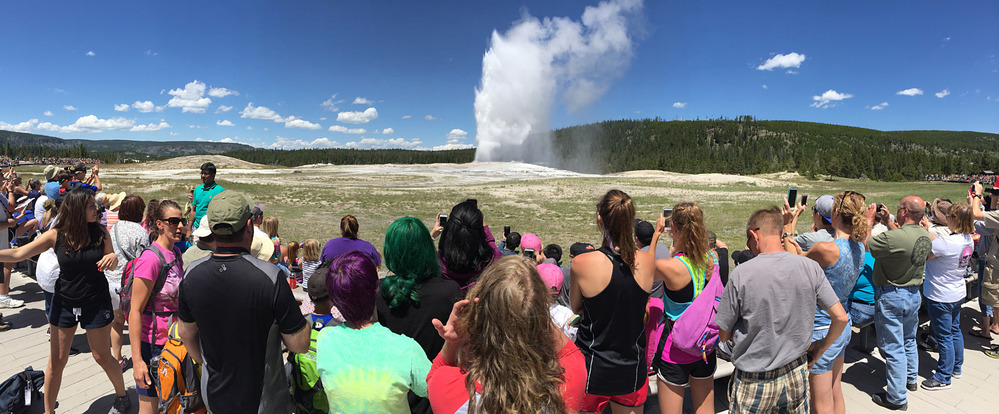 Visitors watching Old Faithful Geyser