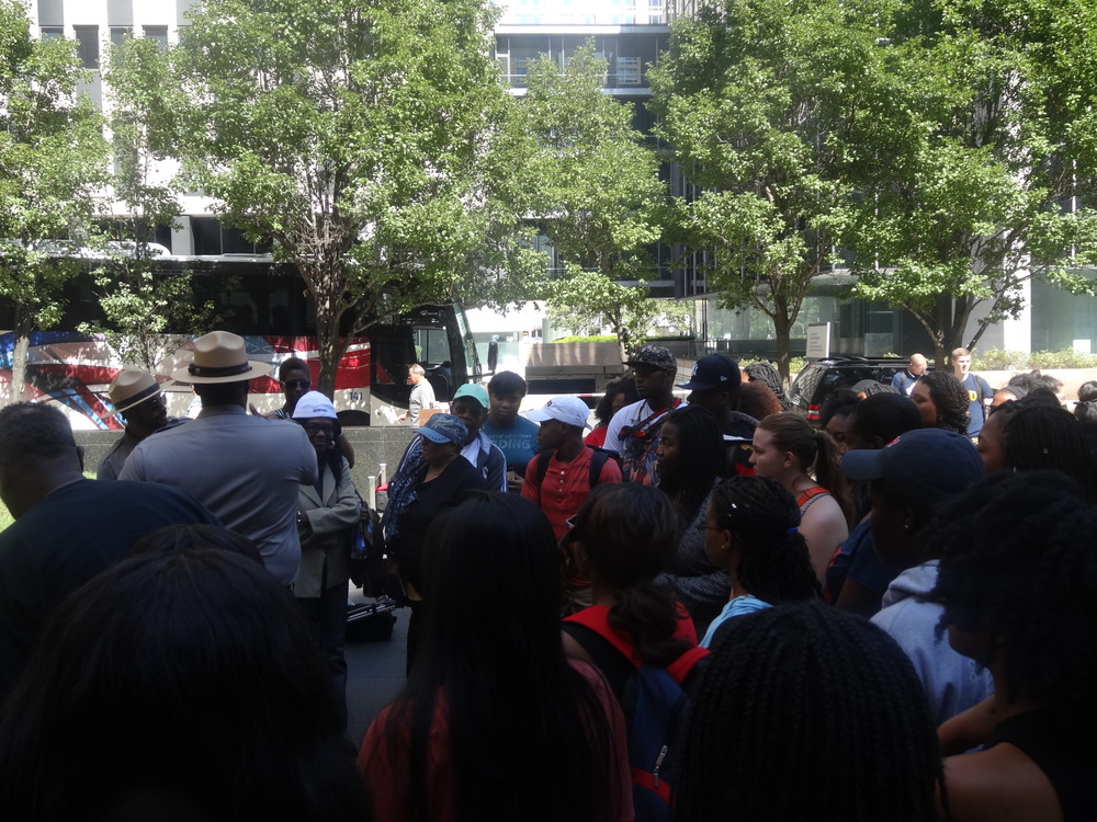 Ranger talks to Howard U. students behind the memorial