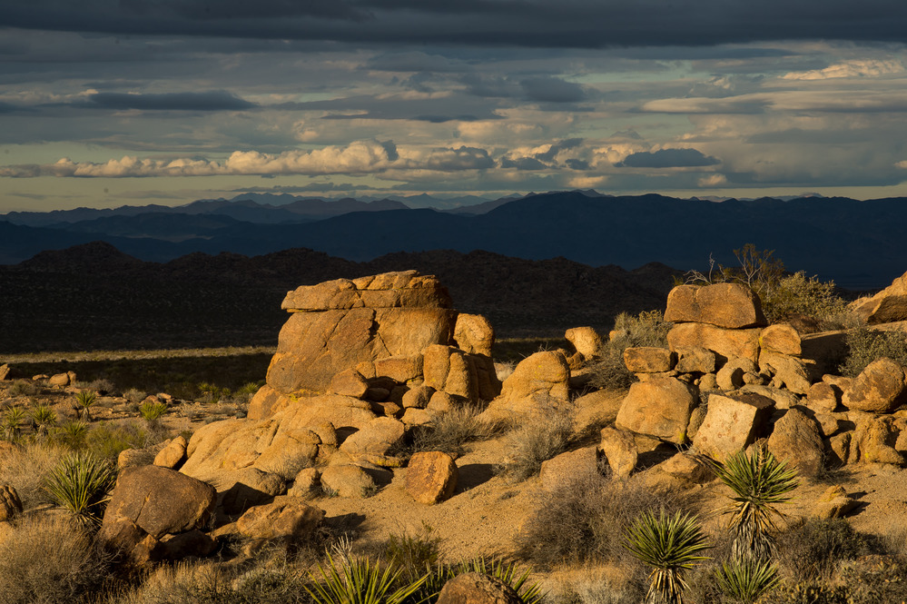 Boulders Glow with Clouds in the Distance