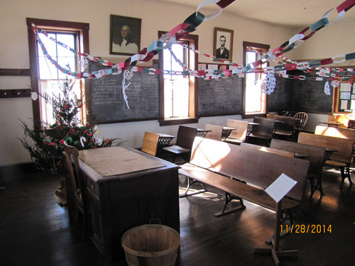 Christmas chains and snowflakes criss-cross the desks
