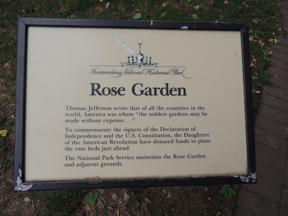 Color photo of wayside detailing the Rose Garden's history.