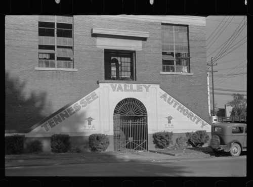 steps on side of brick building with painted sign on them saying 