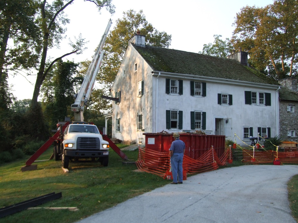 Delivering structural steel beam to second floor.