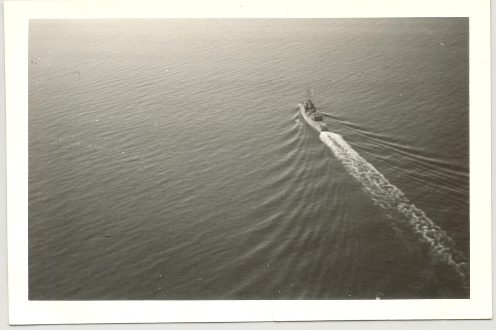 Aerial view of a ship towing a target