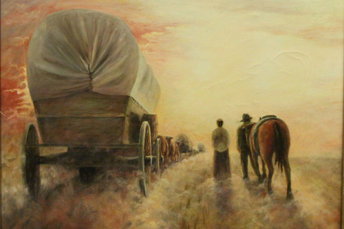A wagon, two adults and a horse walking down a trail