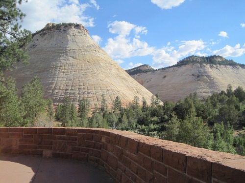 A stone wall with a steep white sandstone slope in the background. 