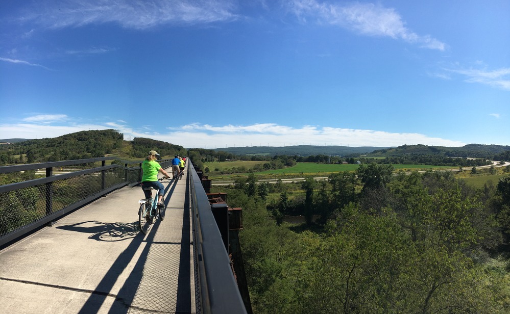 Bikers cross the Salisbury Viaduct, enjoying the sunny day.
