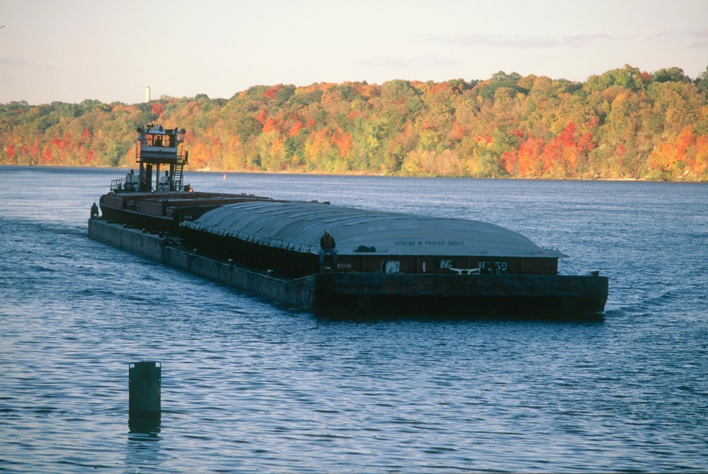 Towboat and barge in river gorge between Minneapolis and St. Paul