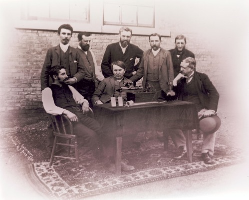 Thomas Edison (seated center), Theo Wangemann (standing center) with the "Perfected Phonograph", June 16, 1888, Edison Laboratory, West Orange, New Jersey. NPS EDIS image 14-650-002.