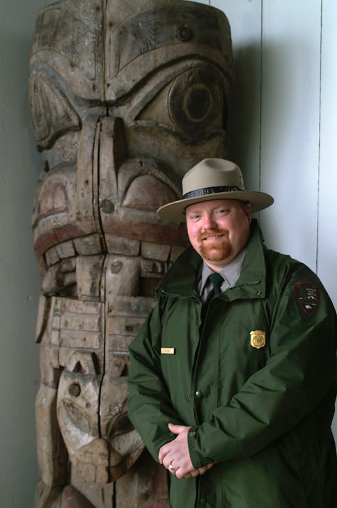Ranger next to fragments of the Yaadaas Crest Corner pole.