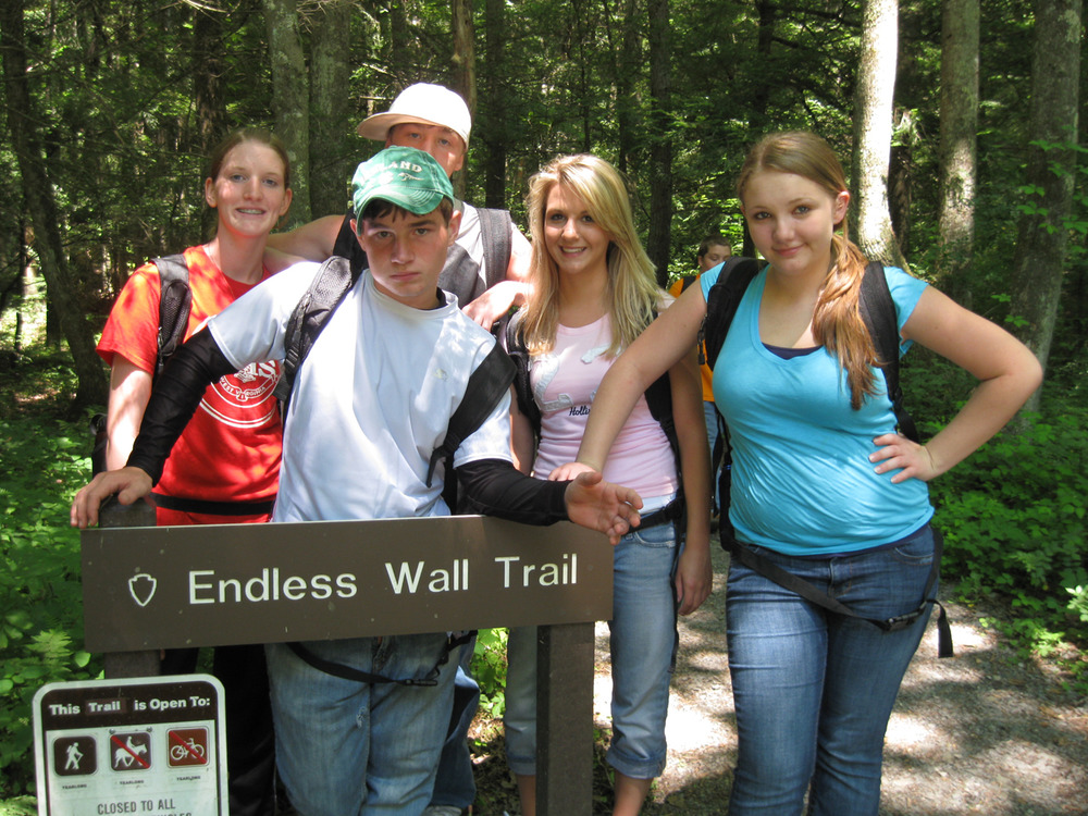 students by a trail sign