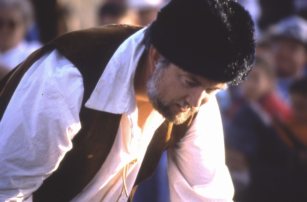 A storyteller entertains the crowd.