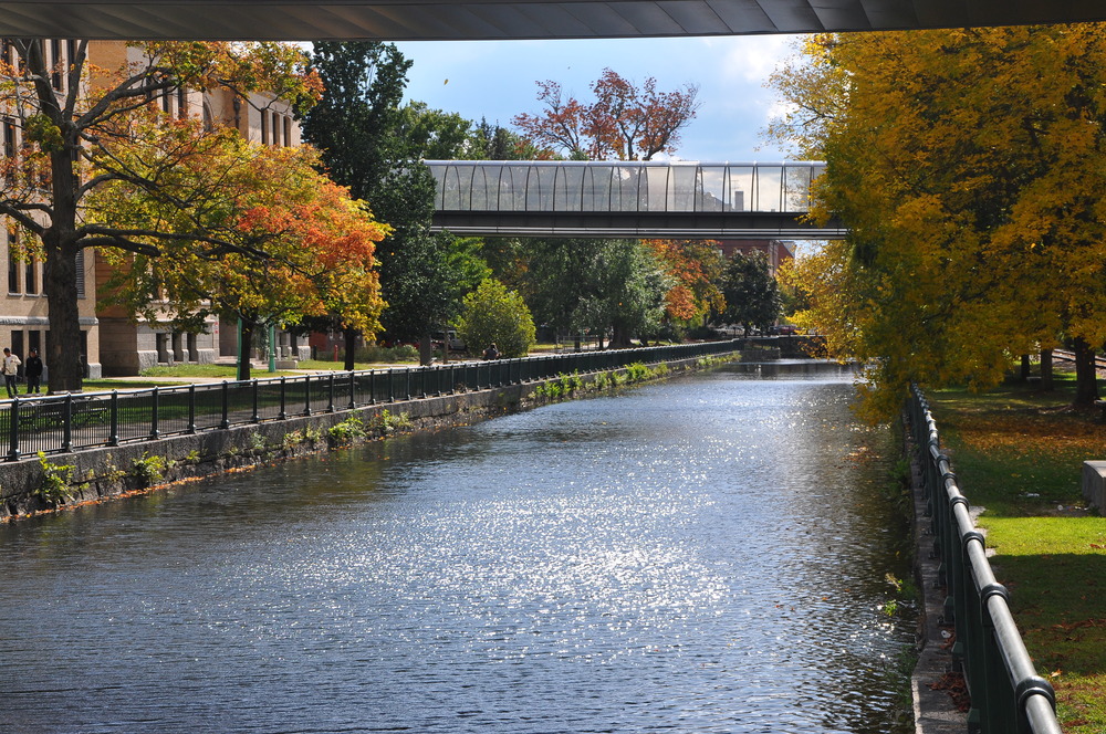 A wide canal cuts through two buildings on the campus of Lowell High School
