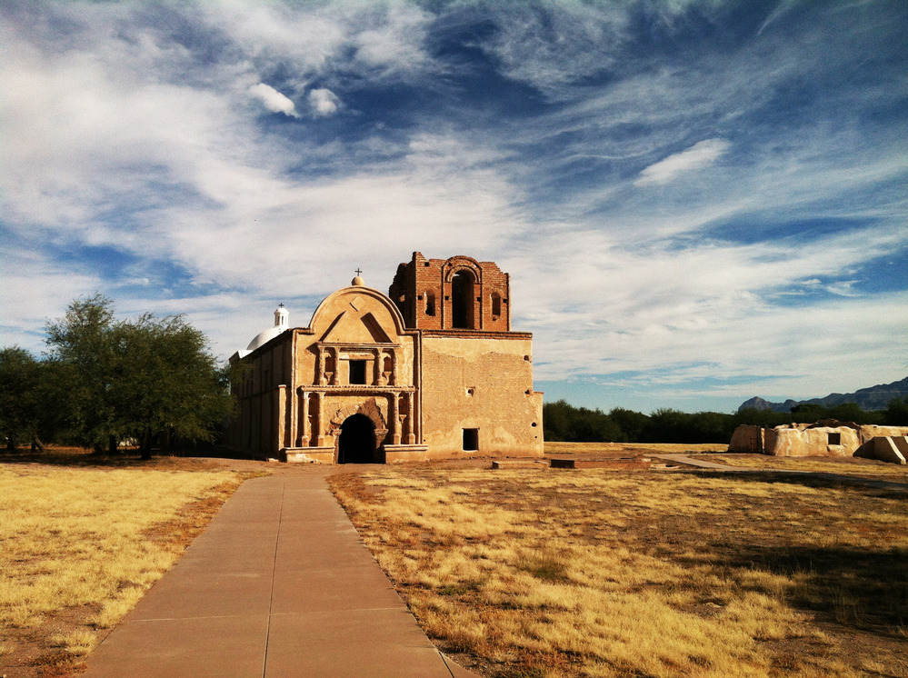 long entrance walkway leading to church facade