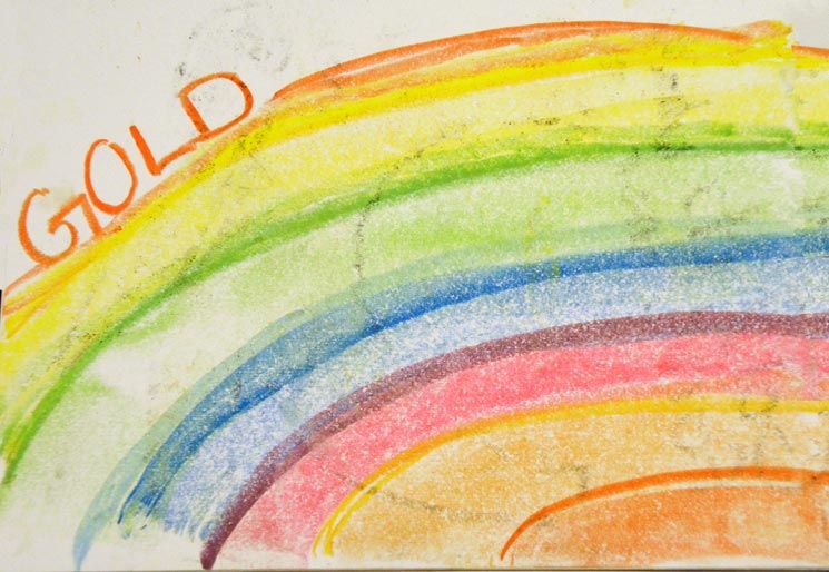 Rainbow with the word Gold over it.