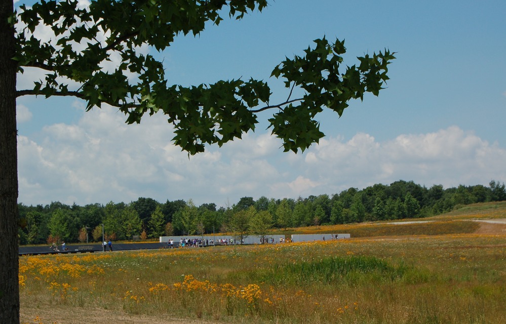 View of the wildflower meadow, the Wall of Names and Memorial Plaza from the area of the Visitor Shelter