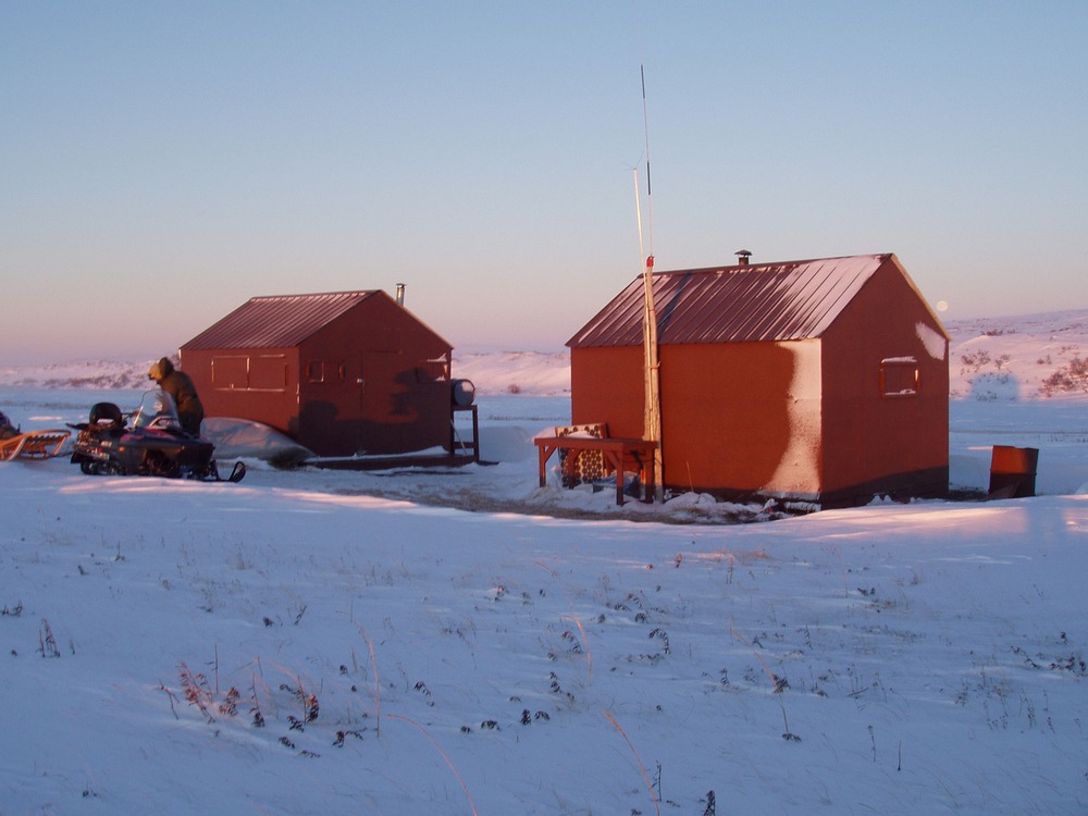 Blue winter light on the snow around a remote ranger station