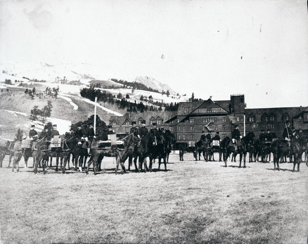 Soldiers on horses in front of National Hotel at Mammoth