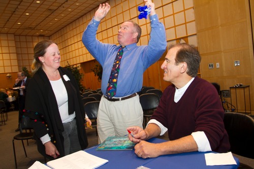Attendees and David Aguilar get excited about the solar system.