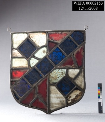 Stained glass of red, white, and blue coat of arms.