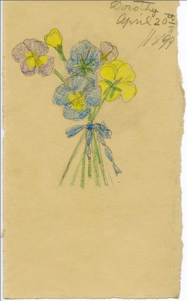 A bundle of blue yellow and purple flowers tied together with blue string.