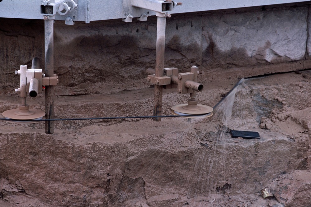 Cable saw cutting the foundation stone beneath the Cape Hatteras Lighthouse in 1999
