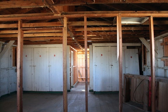 A view of the interior of Fire Station #1after removal of pressed wood walls and ceiling .