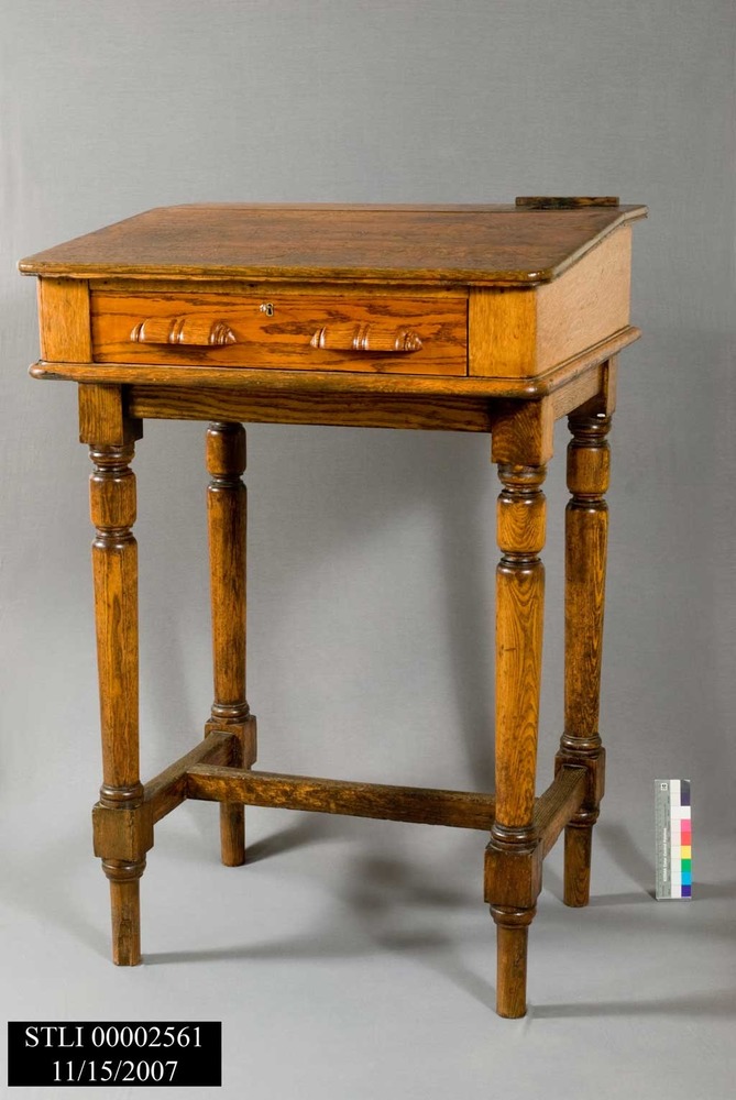 Original desk used by immigration inspectors interviewing new immigrants for admission to the United States.