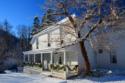 The Camden House dressed up with snow and decorations for the Old Time Holiday Event
