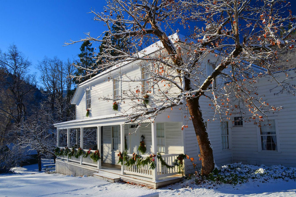 The Camden House dressed up with snow and decorations for the Old Time Holiday Event
